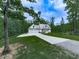 Beautiful exterior view of a white modern farmhouse-style home with a long driveway at 2700 Sam Nelson Rd, Canton, GA 30114