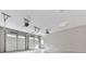 This spacious three-car garage boasts ample storage space and a clean, bright interior with white epoxy floor at 2700 Sam Nelson Rd, Canton, GA 30114
