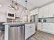Bright kitchen with a large island, stainless steel appliances, and pendant lighting at 2700 Sam Nelson Rd, Canton, GA 30114