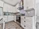 Well-lit kitchen with white cabinets, stainless steel appliances, and a stylish backsplash at 2700 Sam Nelson Rd, Canton, GA 30114