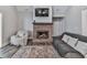 Inviting living room features a fireplace, plush seating, and warm, neutral tones at 2700 Sam Nelson Rd, Canton, GA 30114