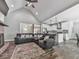 Spacious living room featuring a vaulted ceiling, fireplace, and an open layout to the kitchen at 2700 Sam Nelson Rd, Canton, GA 30114