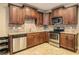 Kitchen with stainless steel appliances, tile backsplash and wood cabinets at 374 Beaumont Farms Dr, Sharpsburg, GA 30277