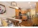 Charming kitchen with wood cabinetry, stainless steel appliances, and hardwood floors at 374 Beaumont Farms Dr, Sharpsburg, GA 30277