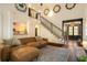 Open-concept living area featuring hardwood floors and staircase at 374 Beaumont Farms Dr, Sharpsburg, GA 30277