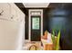 Stylish mudroom with shiplap walls, dark accent wall, a wooden bench, and tiled flooring at 374 Beaumont Farms Dr, Sharpsburg, GA 30277