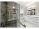Modern bathroom with glass-enclosed shower and white vanity with gold hardware at 852 Washington Sw St, Atlanta, GA 30315