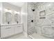 Modern bathroom with double vanity, walk-in shower with gold accents and frameless glass at 852 Washington Sw St, Atlanta, GA 30315