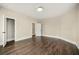 Bright bedroom features hardwood floors, neutral walls, and white trim at 852 Washington Sw St, Atlanta, GA 30315