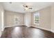 Spacious bedroom featuring wood floors, ceiling fan, and natural light at 852 Washington Sw St, Atlanta, GA 30315