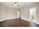 Large bedroom featuring wood floors, ceiling fan, and ensuite bathroom at 852 Washington Sw St, Atlanta, GA 30315