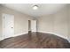 Bright bedroom features hardwood floors, neutral walls, and white trim at 852 Washington Sw St, Atlanta, GA 30315