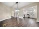 Bright dining room featuring dark wood floors and seamless access to the updated kitchen at 852 Washington Sw St, Atlanta, GA 30315