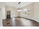 Bright dining room featuring dark wood floors, modern chandelier, and laundry room access at 852 Washington Sw St, Atlanta, GA 30315