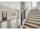 Elegant entryway showcasing wood floors, detailed door, staircase, and chandelier at 852 Washington Sw St, Atlanta, GA 30315