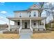 Charming two-story home boasting a spacious front porch and manicured landscaping at 852 Washington Sw St, Atlanta, GA 30315
