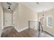 Open hallway with dark floors, white door and baseboards, and lots of light at 852 Washington Sw St, Atlanta, GA 30315