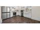 Modern kitchen featuring stainless steel appliances, stylish backsplash, and white cabinets at 852 Washington Sw St, Atlanta, GA 30315