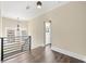 Bright upstairs landing with wood floors, large windows, and metal railings at 852 Washington Sw St, Atlanta, GA 30315
