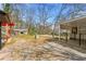Backyard area featuring mature trees and a detached outbuilding at 1082 Green Valley Nw Dr, Conyers, GA 30012