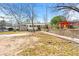 Spacious backyard featuring a well-maintained lawn and mature trees at 1082 Green Valley Nw Dr, Conyers, GA 30012
