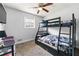 Comfortable bedroom with a bunk bed, soft carpet, and a ceiling fan at 1082 Green Valley Nw Dr, Conyers, GA 30012