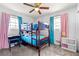 Colorful bedroom with a bunk bed, soft carpet, and plenty of natural light at 1082 Green Valley Nw Dr, Conyers, GA 30012