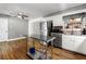 Spacious kitchen featuring stainless steel appliances, white cabinets, and modern flooring at 1082 Green Valley Nw Dr, Conyers, GA 30012