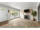 Bright living room featuring a large window, neutral carpet, and a cozy atmosphere at 1082 Green Valley Nw Dr, Conyers, GA 30012