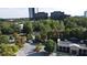Aerial view of the community and surrounding areas with lush trees and city buildings at 11 Perimeter E Ctr # 1203, Dunwoody, GA 30346
