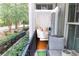 Inviting balcony with comfortable seating that flows into an interior seating area with hardwood floors at 11 Perimeter E Ctr # 1203, Dunwoody, GA 30346