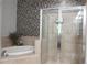 Elegant bathroom featuring a shower, soaking tub, and decorative tile work throughout at 11 Perimeter E Ctr # 1203, Dunwoody, GA 30346