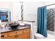 Charming bathroom features a wood vanity with a vessel sink, decorative mirror and tiled shower at 11 Perimeter E Ctr # 1203, Dunwoody, GA 30346