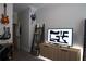 Neutral bedroom with mounted decor and a TV on a low, wooden cabinet at 11 Perimeter E Ctr # 1203, Dunwoody, GA 30346