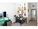 Bedroom features an exercise bike and guitars mounted on the wall for decor at 11 Perimeter E Ctr # 1203, Dunwoody, GA 30346