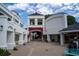 Attractive courtyard with white buildings, archway, and beautiful pink flowering vines at 11 Perimeter E Ctr # 1203, Dunwoody, GA 30346