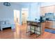 Open kitchen features a central island with bar seating, hardwood floors, and modern cabinetry at 11 Perimeter E Ctr # 1203, Dunwoody, GA 30346