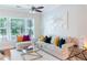 Cozy living room with natural light, a decorative painting and comfortable seating at 11 Perimeter E Ctr # 1203, Dunwoody, GA 30346