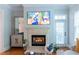 Living room showcasing a fireplace, stylish decor, and hardwood flooring at 11 Perimeter E Ctr # 1203, Dunwoody, GA 30346