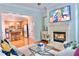 Inviting living room featuring a fireplace and an open view to the kitchen with bar seating at 11 Perimeter E Ctr # 1203, Dunwoody, GA 30346