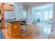Open concept kitchen and living room featuring hardwood floors and modern appliances at 11 Perimeter E Ctr # 1203, Dunwoody, GA 30346