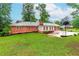 Expansive green backyard, featuring a brick facade, patio and a basketball area at 201 Smithstone Path, Fayetteville, GA 30214