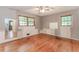 Spacious bedroom featuring hardwood floors, natural light, and ensuite bath potential at 201 Smithstone Path, Fayetteville, GA 30214