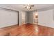 Bedroom featuring hardwood floors, neutral walls, and potential for closet customization at 201 Smithstone Path, Fayetteville, GA 30214
