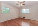 Bright bedroom features hardwood floors and neutral walls, ready for personalization at 201 Smithstone Path, Fayetteville, GA 30214