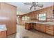 Vintage kitchen featuring wood cabinets, patterned floors, and a double basin stainless steel sink at 201 Smithstone Path, Fayetteville, GA 30214
