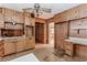 Kitchen with wood cabinetry and white laminate countertops, perfect for renovation at 201 Smithstone Path, Fayetteville, GA 30214
