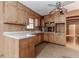 Kitchen with light wood cabinets, laminate countertops, and an eat-in countertop at 201 Smithstone Path, Fayetteville, GA 30214