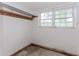 Room features natural light from the window and unfinished floors and walls at 201 Smithstone Path, Fayetteville, GA 30214