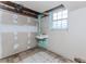 Room featuring unfinished floors and walls with natural light from the window at 201 Smithstone Path, Fayetteville, GA 30214